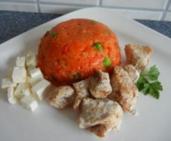 Hähnchen an Tomatenreis mit Hirtenkäse