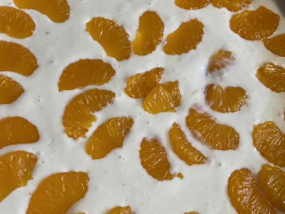 Käsekuchen mit Schokoladenboden und Mandarinentopping