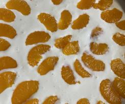 Käsekuchen mit Schokoladenboden und Mandarinentopping