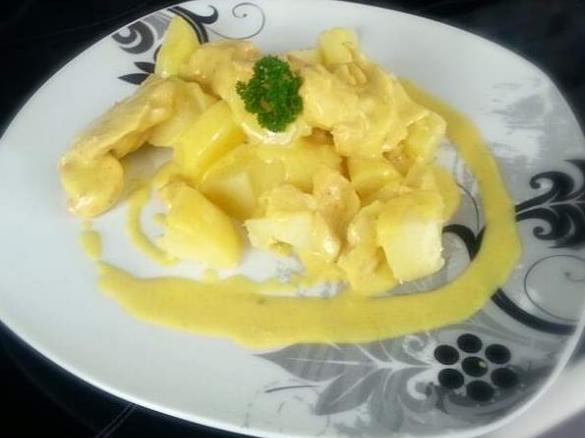 Geflügelgeschnetzeltes mit Kartoffel an Curry-Orangensauce